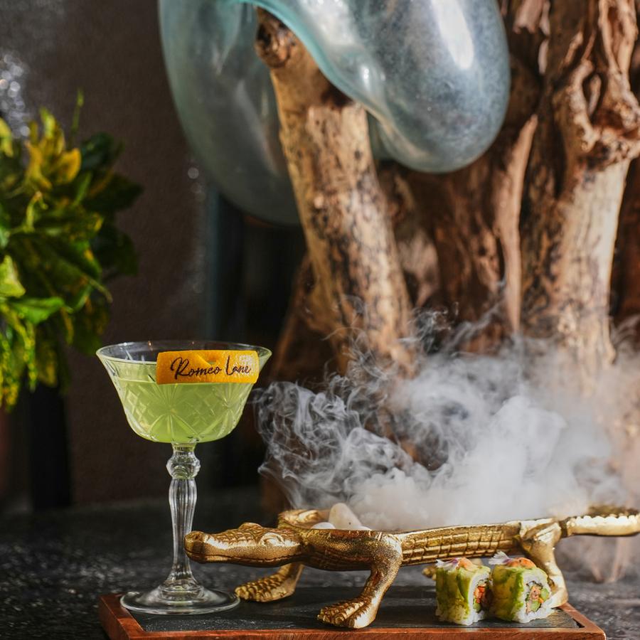 A cocktail served over smoking dry ice