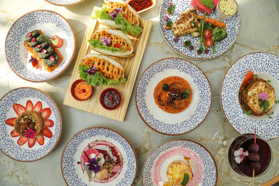 A spread of plated dishes on blue-and-white crockery
